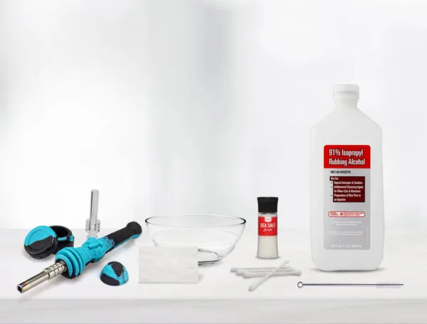 Dab rig cleaning kit with isopropyl alcohol, sea salt, silicone nectar collector, and tools.