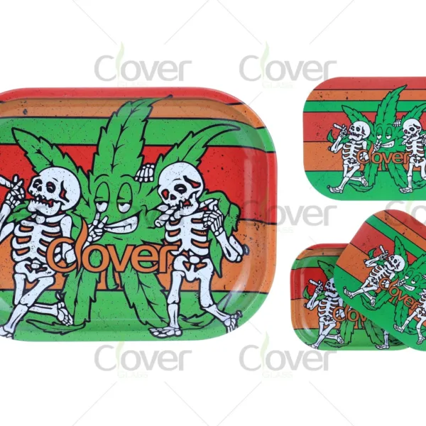 Rasta weed rolling tray set with reggae color stripes and dancing skeletons. Metal trays by Clover Glass, perfect for 420 shops and cultural events.