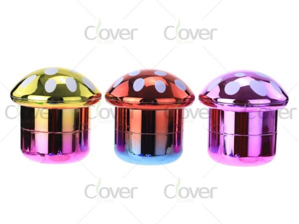 Colorful mushroom-shaped metal herb grinders in bulk display — 2-piece spice crusher set for dry herb by CloverGlass