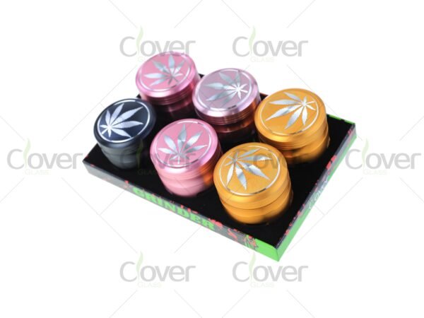 Metal herb grinders with engraved cannabis leaf design — 4-piece dry herb crushers in assorted colors, bulk display by CloverGlass