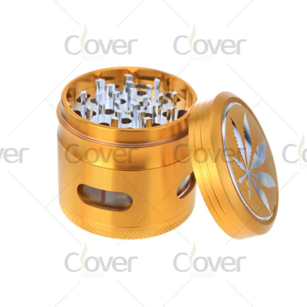 Metal herb grinders with engraved cannabis leaf design — 4-piece dry herb crushers in assorted colors, bulk display by CloverGlass