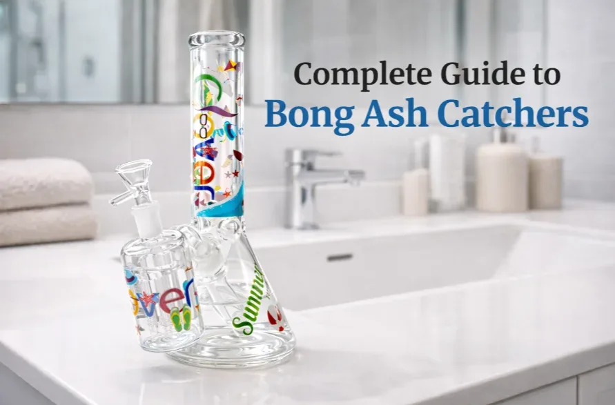 Colorful, summer-themed glass bong with ash catcher on a clean bathroom counter.