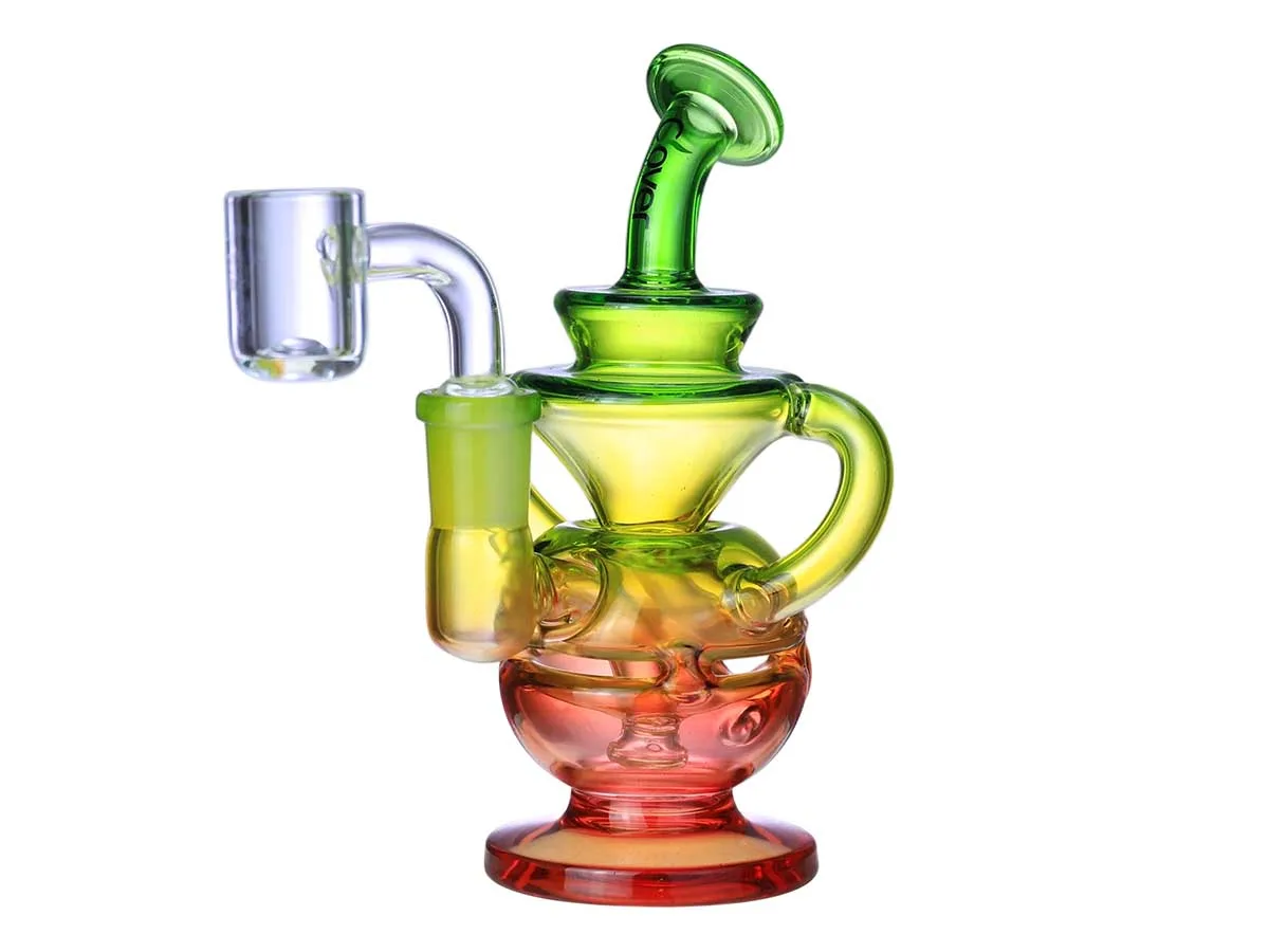 Colorful gradient glass dab rig with green, yellow, red hues and quartz banger.