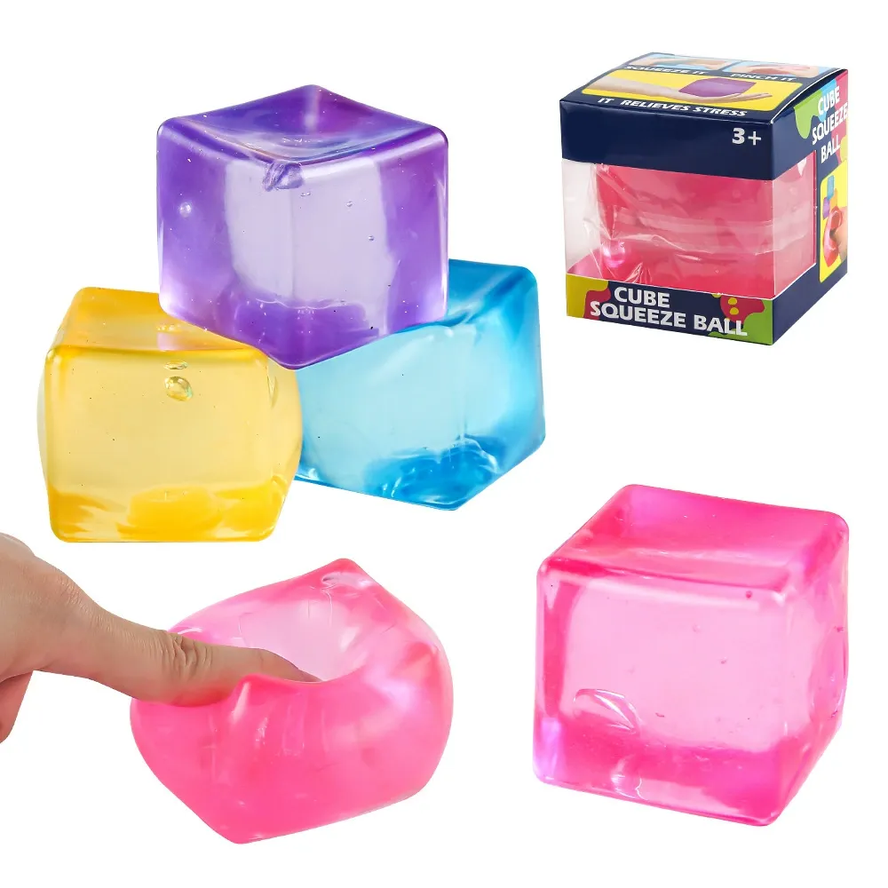 Colorful translucent cube squeeze balls, one being squeezed, with packaging.
