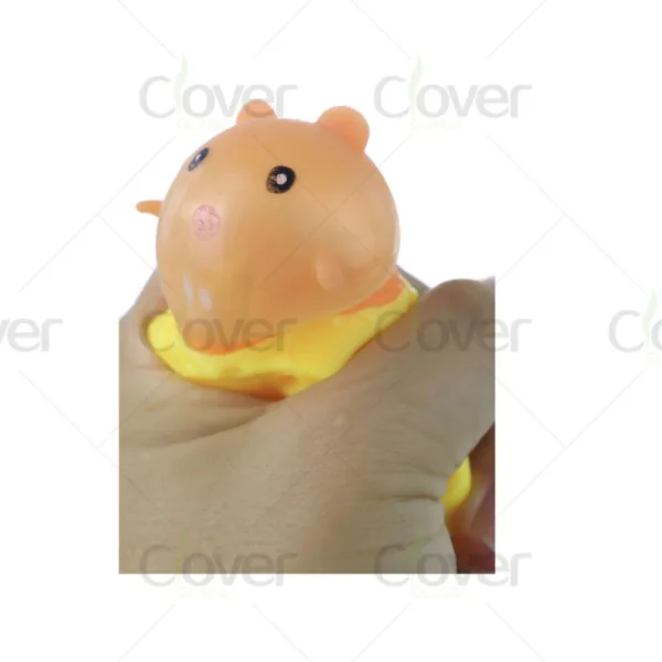Hand squeezing a cute orange and yellow hamster-like squishy toy.