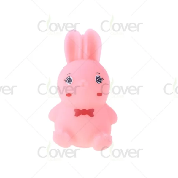 Cute pink rubber rabbit toy with big eyes and a charming red bow tie.