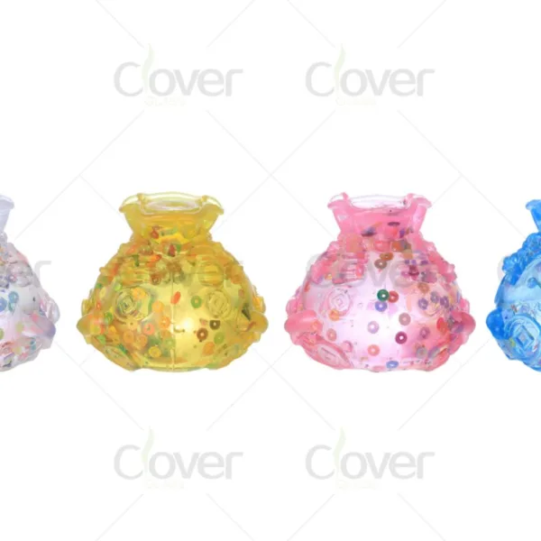 Four colorful decorative glass money bag containers with confetti on white background.