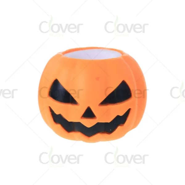 Orange ceramic jack-o'-lantern pot with spooky carved face for Halloween.