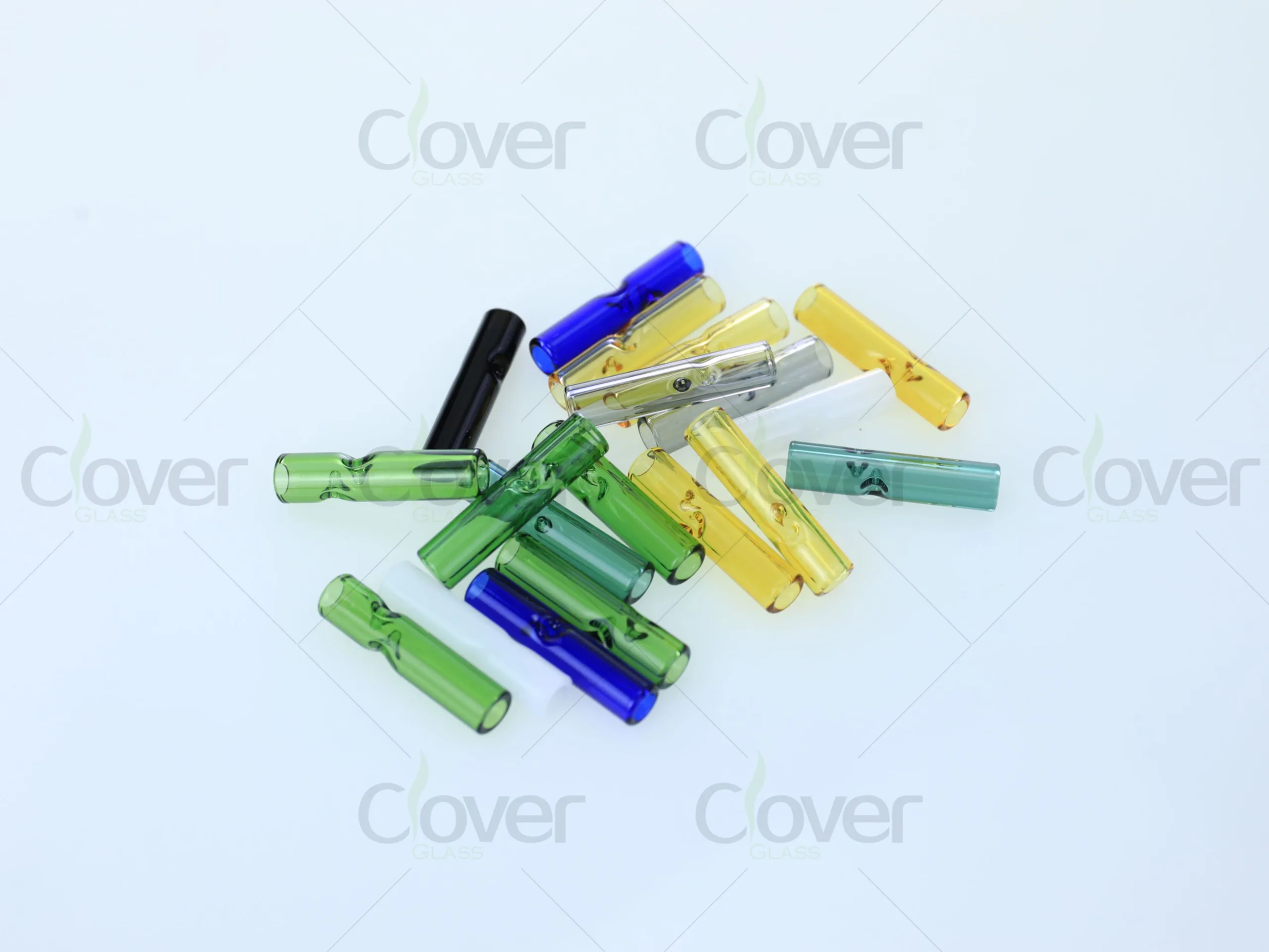 Assorted colorful glass smoking filter tips with pinch design.