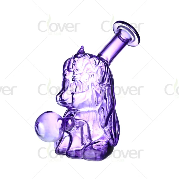 Purple glass water pipe shaped like a cartoon dog holding a ball.