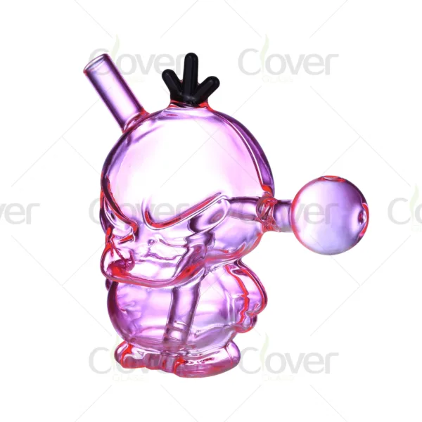 Unique pink glass skull head pipe with black crown and spherical side piece.