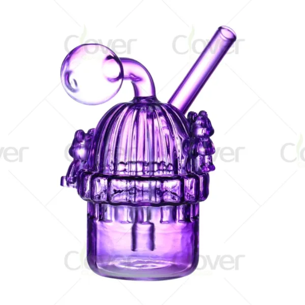 Vibrant purple glass mini bong with charming bear figurines and ribbed dome top.