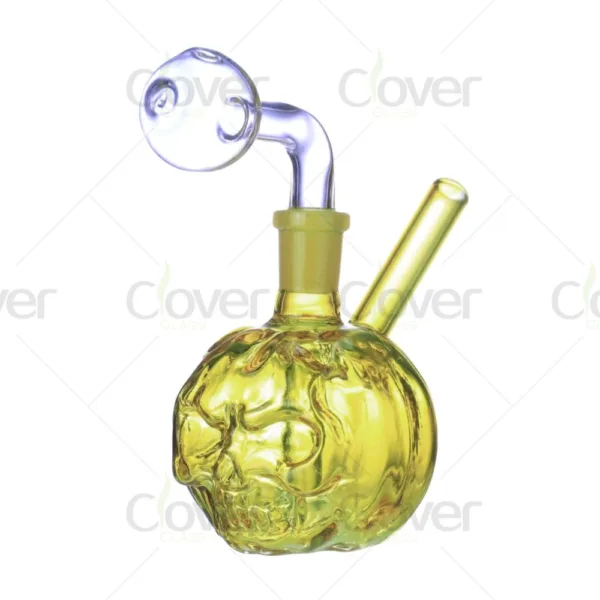 Yellow glass skull design oil burner pipe with clear bubble attachment.